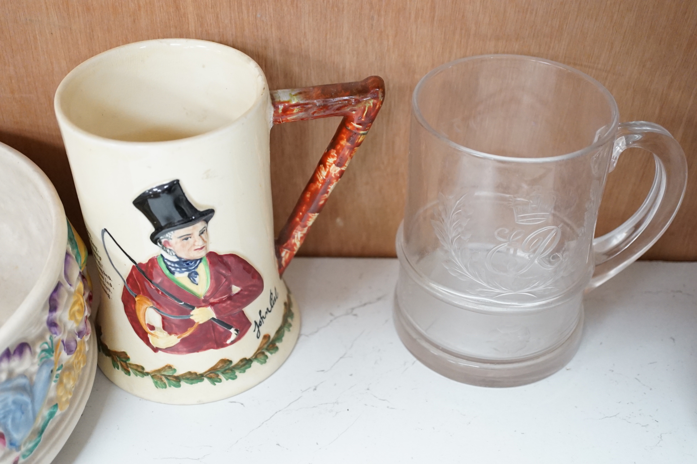 Two Royal Doulton flambé vases, a Wedgwood monkey, a Clarice Cliff bowl, a Crown Devon musical hunting mug, etc., tallest flambé vase 22cm